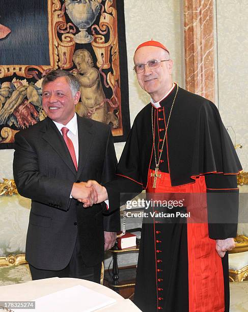 Vatican Secretary of State, Cardinal Tarcisio Bertone meets King Abdullah II of Jordan after an audience with Pope Francis at the Pope's private...