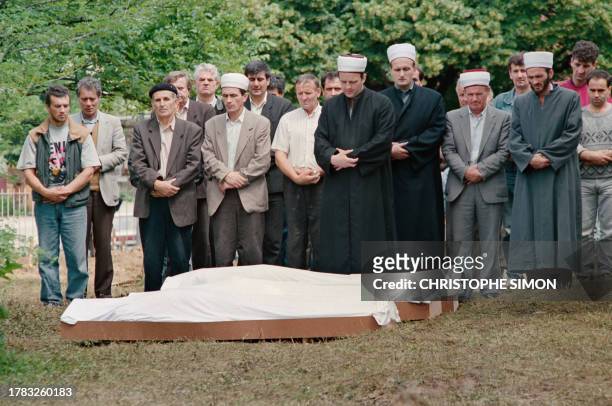 Yugoslavian Muslims bury three of their compatriots in the cemetary of Sarajevo's public hospital, on June 20, 1992. According to a count by...