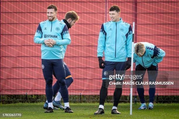 Denmark's Pierre Emile Hojbjerg and Andreas Christensen attend a training session on November 15, 2023 in Helsingor, Denmark, as the team prepares...