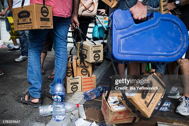 Israeli citizens gather in the city of Haifa to change and pick up gas masks as tension surrounding the Syrian crisis escalates on August 29, 2013 in...