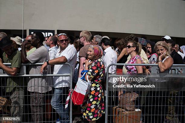 Israeli citizens gather in the city of Haifa to change and pick up gas masks as tension surrounding the Syrian crisis escalates on August 29, 2013 in...