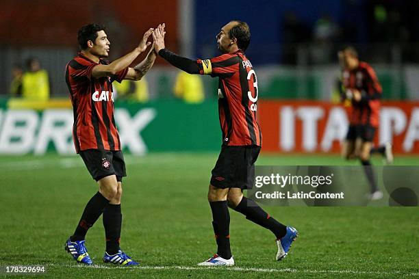 Zezinho and Paulo Baier of Atlético Paranaense celebrate a goal against Palmeiras during a match between Atlético Paranaense and Palmeiras as part of...