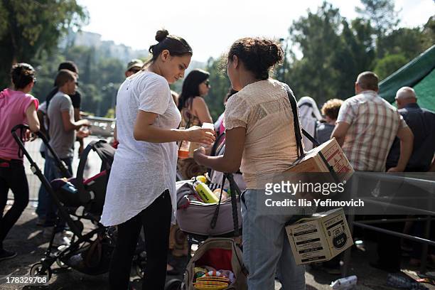Israeli citizens gather in the city of Haifa to change and pick up gas masks as tension surrounding the Syrian crisis escalates on August 29, 2013 in...