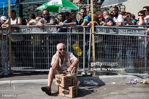 Israeli citizens gather in the city of Haifa to change and pick up gas masks as tension surrounding the Syrian crisis escalates on August 29, 2013 in...