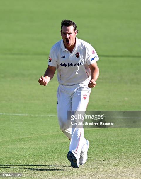Ben Manenti of South Australia celebrates taking the wicket of Jack Clayton of Queensland during day four of the Sheffield Shield match between...