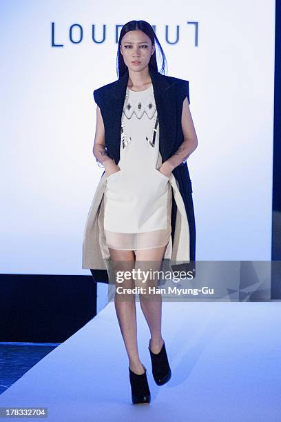 Model walks the runway at the "Loudmut" launching fashion show at the JNB gallery on August 29, 2013 in Seoul, South Korea.