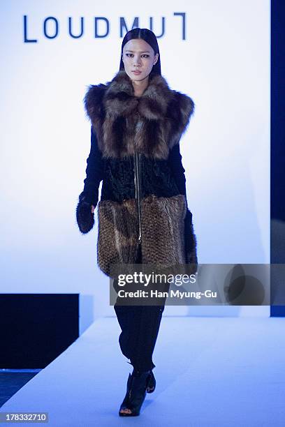 Model walks the runway at the "Loudmut" launching fashion show at the JNB gallery on August 29, 2013 in Seoul, South Korea.