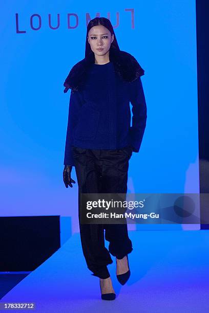 Model walks the runway at the "Loudmut" launching fashion show at the JNB gallery on August 29, 2013 in Seoul, South Korea.