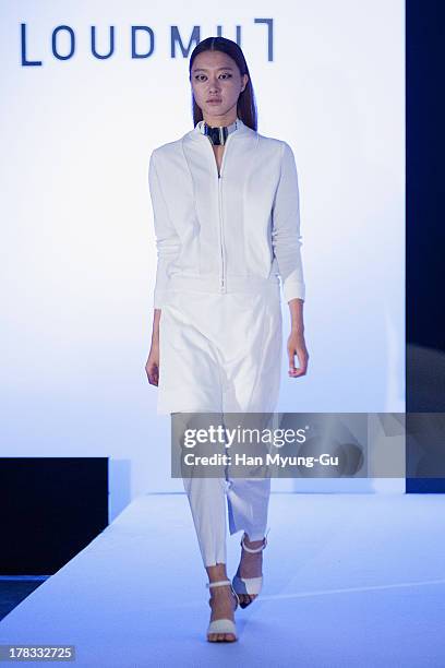 Model walks the runway at the "Loudmut" launching fashion show at the JNB gallery on August 29, 2013 in Seoul, South Korea.