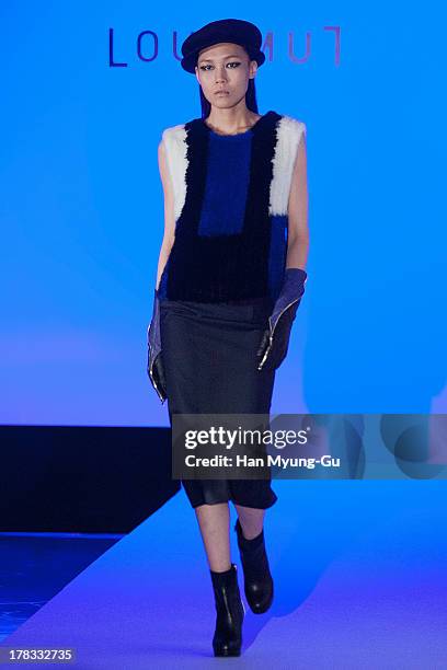 Model walks the runway at the "Loudmut" launching fashion show at the JNB gallery on August 29, 2013 in Seoul, South Korea.