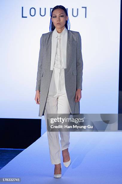 Model walks the runway at the "Loudmut" launching fashion show at the JNB gallery on August 29, 2013 in Seoul, South Korea.