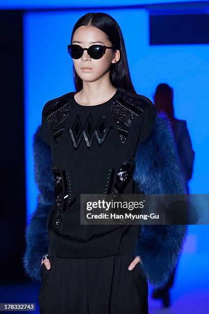 Model walks the runway at the "Loudmut" launching fashion show at the JNB gallery on August 29, 2013 in Seoul, South Korea.