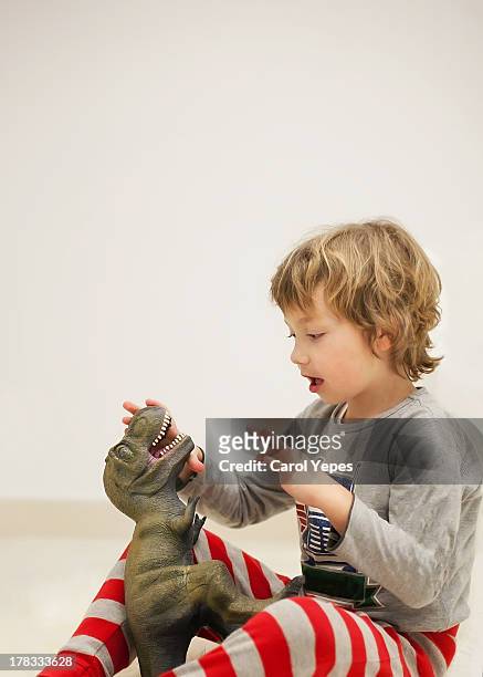 boy and dinosaur - dinosaur toy i stock pictures, royalty-free photos & images