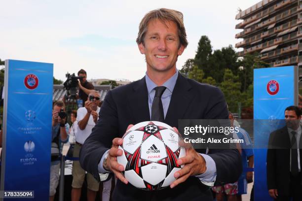 Edwin van der Sar poses outside the Grimaldi Forum with the adidas official match ball 'Finale 13' prior to the Champions League Draw on August 29,...