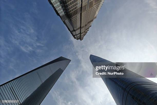 The spires of Shanghai Tower, Jinmao Tower and World Financial Center are seen in Shanghai, China, November 15, 2023.