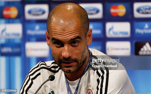 In this handout image provided by UEFA, Manager Josep Guardiola of Bayern Munich talks to the media prior to the UEFA Super Cup match between Bayern...