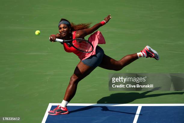 Serena Williams of the United States of America plays a forehand during her women's singles second round match against Galina Voskoboeva of...