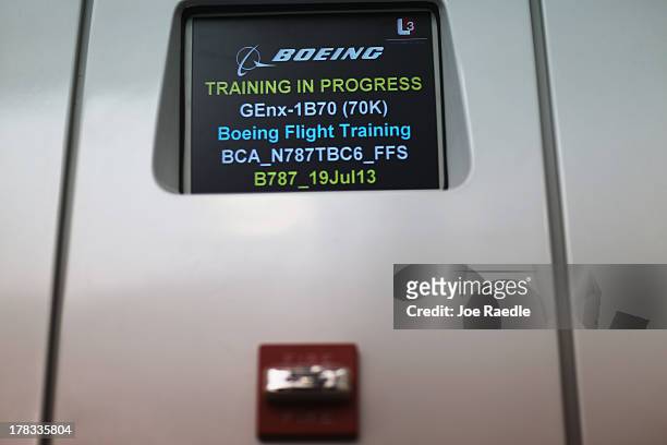 Sign is seen outside one of the full-flight simulators for the 787 Dreamliner on August 29, 2013 in Miami, Florida. The simulator is in the newly...