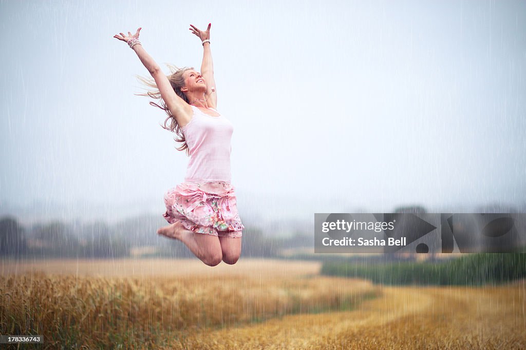 Girl Jumping In The Rain