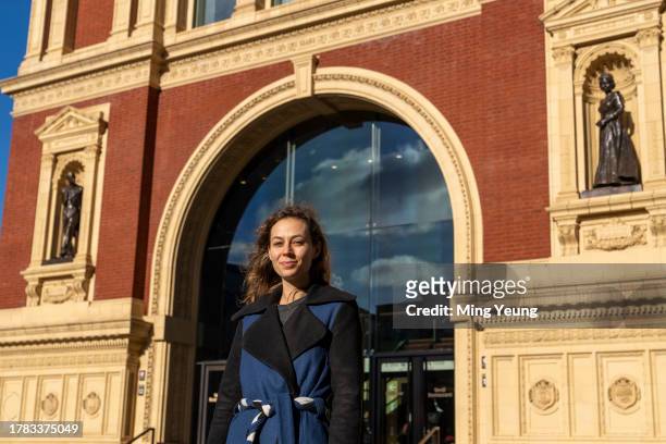 Artist Poppy Field in front of the bronze sculptures of the late Queen Elizabeth and Prince Phillip she created at Royal Albert Hall on November 15,...
