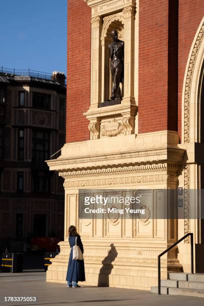 Artist Poppy Field in front of the bronze sculpture of the late Prince Phillip she created at Royal Albert Hall on November 15, 2023 in London,...