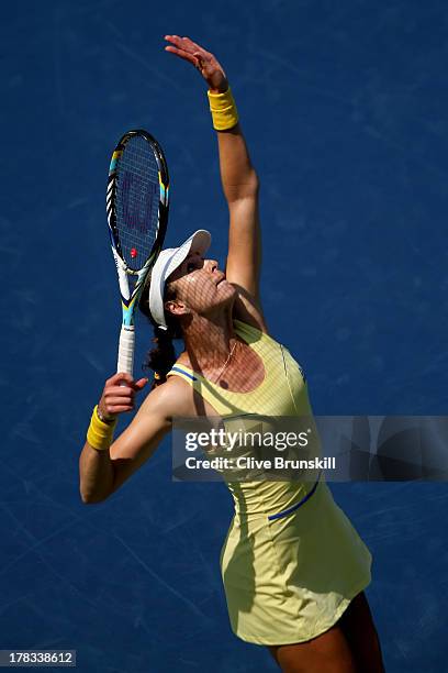 Galina Voskoboeva of Kazakhstan serves to Serena Williams of the United States during their second round women's singles match on Day Four of the...