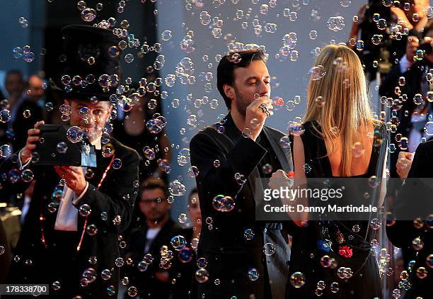 Matteo Ceccarini and actress Eva Riccobono blow bubbles during the "Tracks" Premiere during the 70th Venice International Film Festival on August 29,...