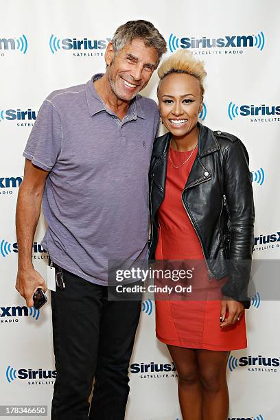 Singer Emeli Sande poses with SiriusXM host Mark Goodman at the SiriusXM Studios on August 29, 2013 in New York City.