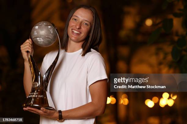 Iga Swiatek of Poland poses with the Chris Evert Trophy after finishing the year in the WTA singles rankings after the GNP Seguros WTA Finals Cancun...