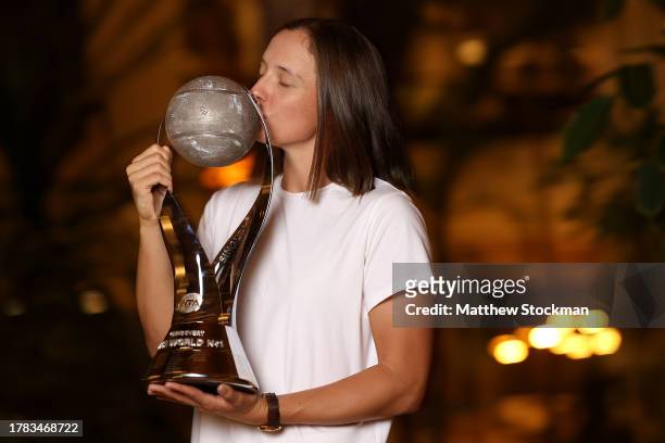 Iga Swiatek of Poland poses with the Chris Evert Trophy after finishing the year in the WTA singles rankings after the GNP Seguros WTA Finals Cancun...