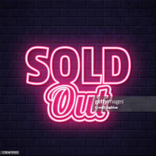 sold out. glowing neon icon on brick wall background - sold out stock illustrations