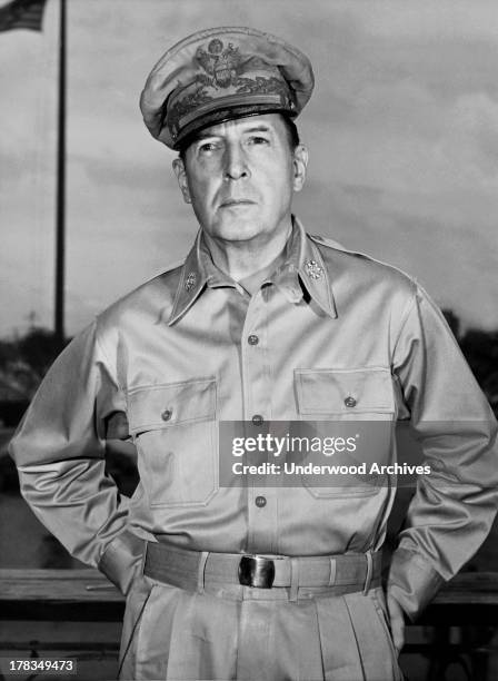 General Douglas MacArthur on the veranda of his office in Manila shortly before he left for Tokyo after Japan had surrendered two weeks previously,...