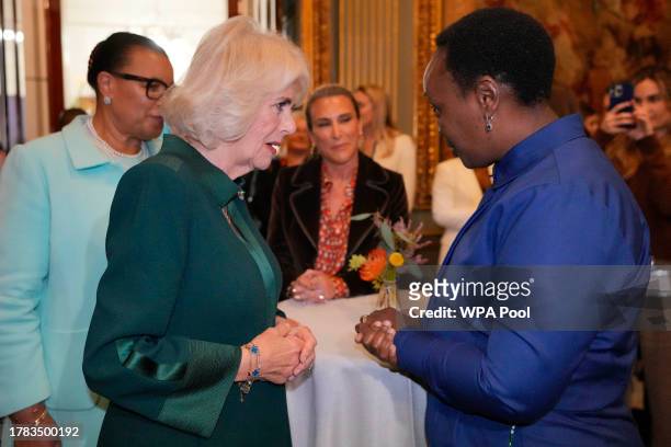 Queen Camilla talks to guests as she attends the Commonwealth Women Leader's event at Marlborough House on November 15, 2023 in London, England. The...