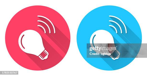 smart light bulb. round icon with long shadow on red or blue background - red light bulb stock illustrations