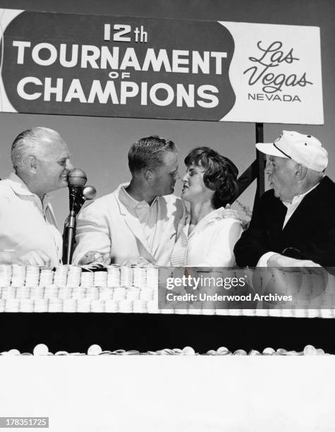 Professional golfer Jack Nicklaus kisses his wife after winning the Tournament of Champions at the Desert Inn Country Club. Desert Inn owner Wilbur...