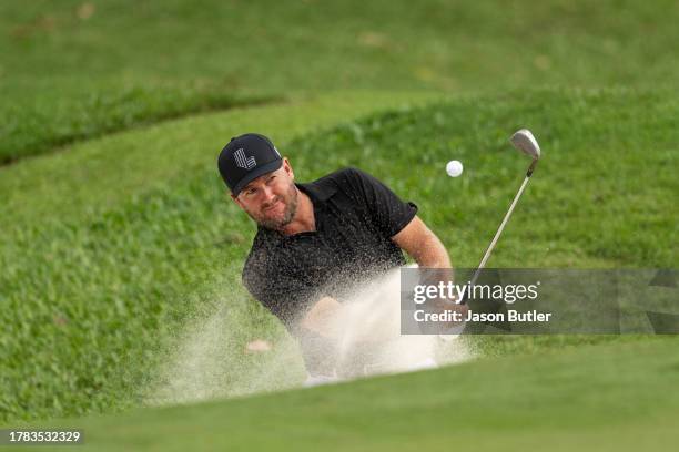 Graeme McDowell of Northern Ireland plays from the green-side bunker on hole 13 during the first round of the Hong Kong Open at Hong Kong Golf Club...