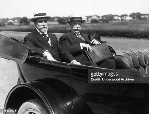 Charles Evans Hughes, the Republican candidate for President, and William Howard Taft, the former President, arrive in Hughes' car at Hughes' summer...