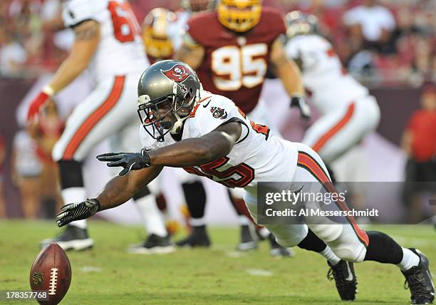 Running back Mike James of the Tampa Bay Buccaneers dives for a pass in the first quarter against the Washington Redskins August 29, 2013 at Raymond...