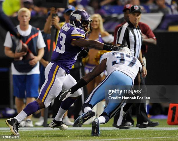 Joe Banyard of the Minnesota Vikings avoids a tackle by Tommie Campbell of the Tennessee Titans during the second quarter of the game on August 29,...