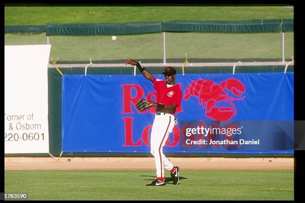 Michael Jordan of the Scottsdale Scorpions throws the ball during an Arizona Fall League game.