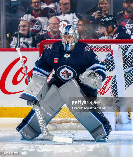 Goaltender Laurent Brossoit of the Winnipeg Jets warms up in his crease prior to NHL action against the Nashville Predators at Canada Life Centre on...
