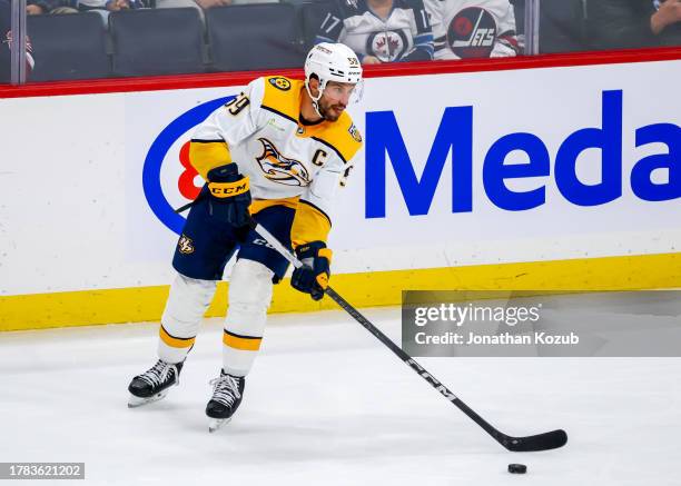 Roman Josi of the Nashville Predators plays the puck during third period action against the Winnipeg Jets at Canada Life Centre on November 09, 2023...