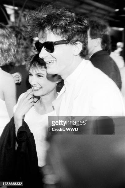 Nancye Ferguson and Mark Mothersbaugh attend an event at Mann's Chinese Theatre in Hollywood, California, on July 26, 1984.