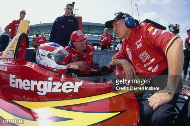 Jimmy Vasser of the United States, driver of the Target Chip Ganassi Racing Reynard 98i Honda HRK in discussion with race engineers Julian Robertson...