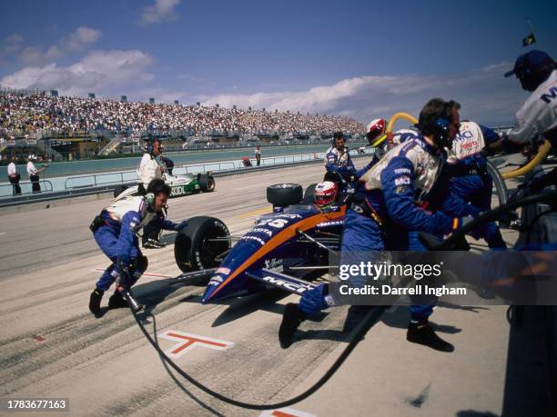 Max Papis from Italy, driver of the MCI Arciero-Wells Racing Reynard 98i Toyota RV8C makes a pitstop for refueling and tyres during the Championship...