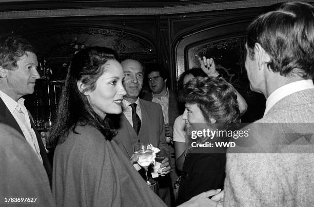 Barbara Carrera , James Caan , Berthe Jourdan , and Louis Jourdan attend a party, celebrating the publication of Alexander Walker's "The Shattered...