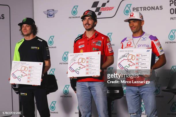 Marco Bezzecchi of Italy and Mooney VR46 Racing Team, Francesco Bagnaia of Italy and Ducati Lenovo Team, Jorge Martin of Spain and Pramac Racing pose...