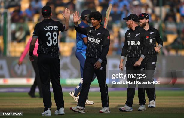 Rachin Ravindra of New Zealand celebrates the wicket of Dushmantha Chameera of Sri Lanka during the ICC Men's Cricket World Cup India 2023 between...