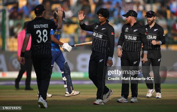 Rachin Ravindra of New Zealand celebrates the wicket of Dushmantha Chameera of Sri Lanka during the ICC Men's Cricket World Cup India 2023 between...