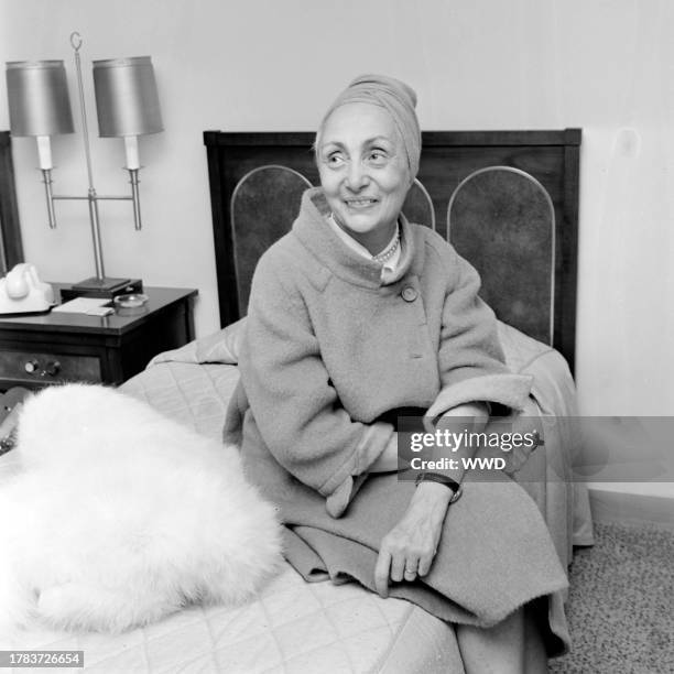Designer Madame Gres answers questions during an interview in the Americana Hotel in New York City, before attending the April in Paris Ball.